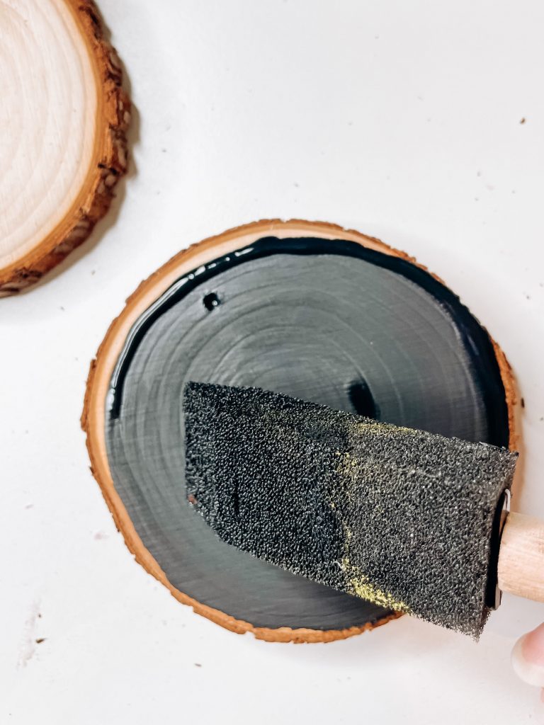 painting the wood slice christmas ornament

